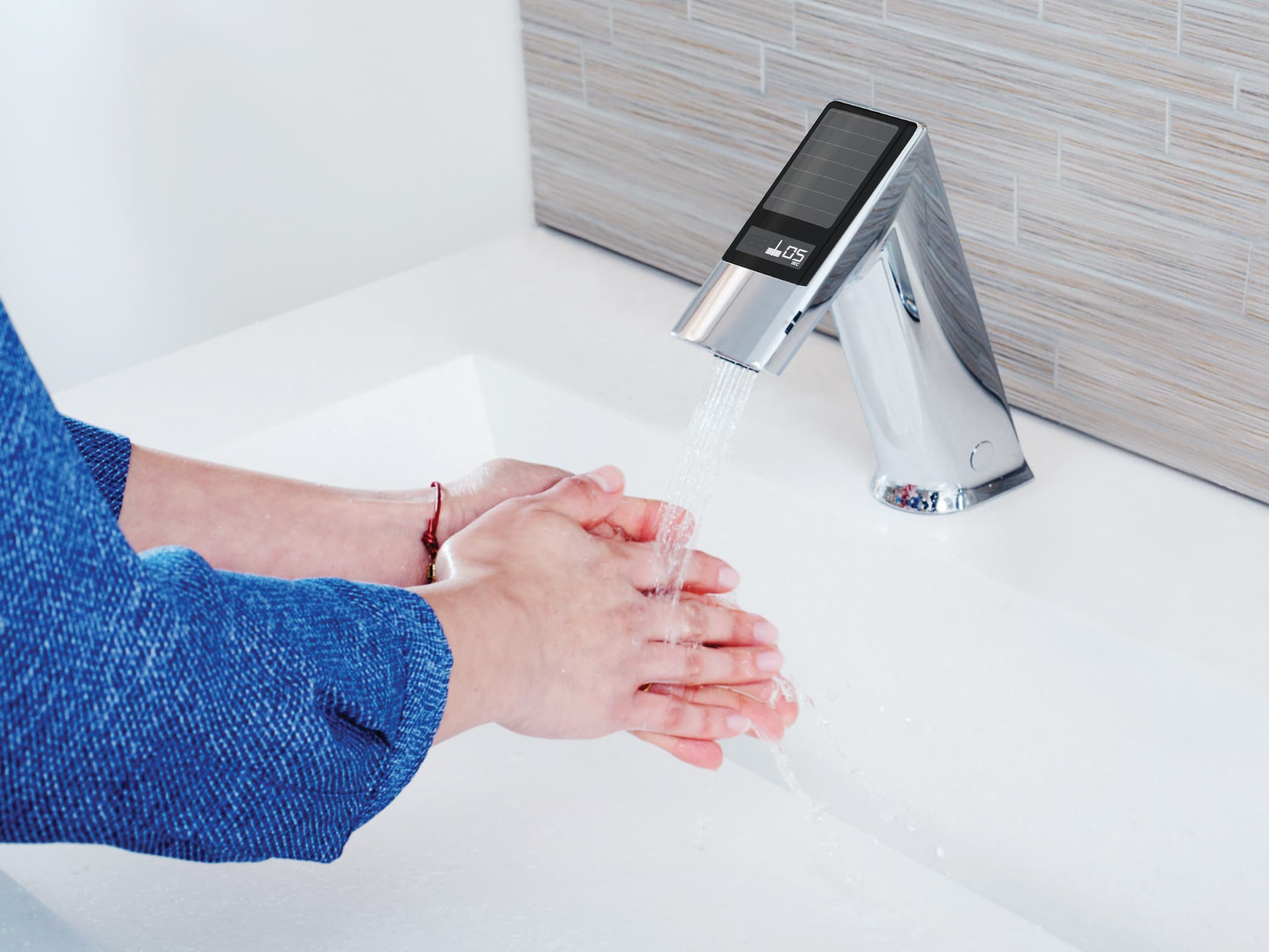 Washing hands with the BASYS® Guided Handwashing Faucet.