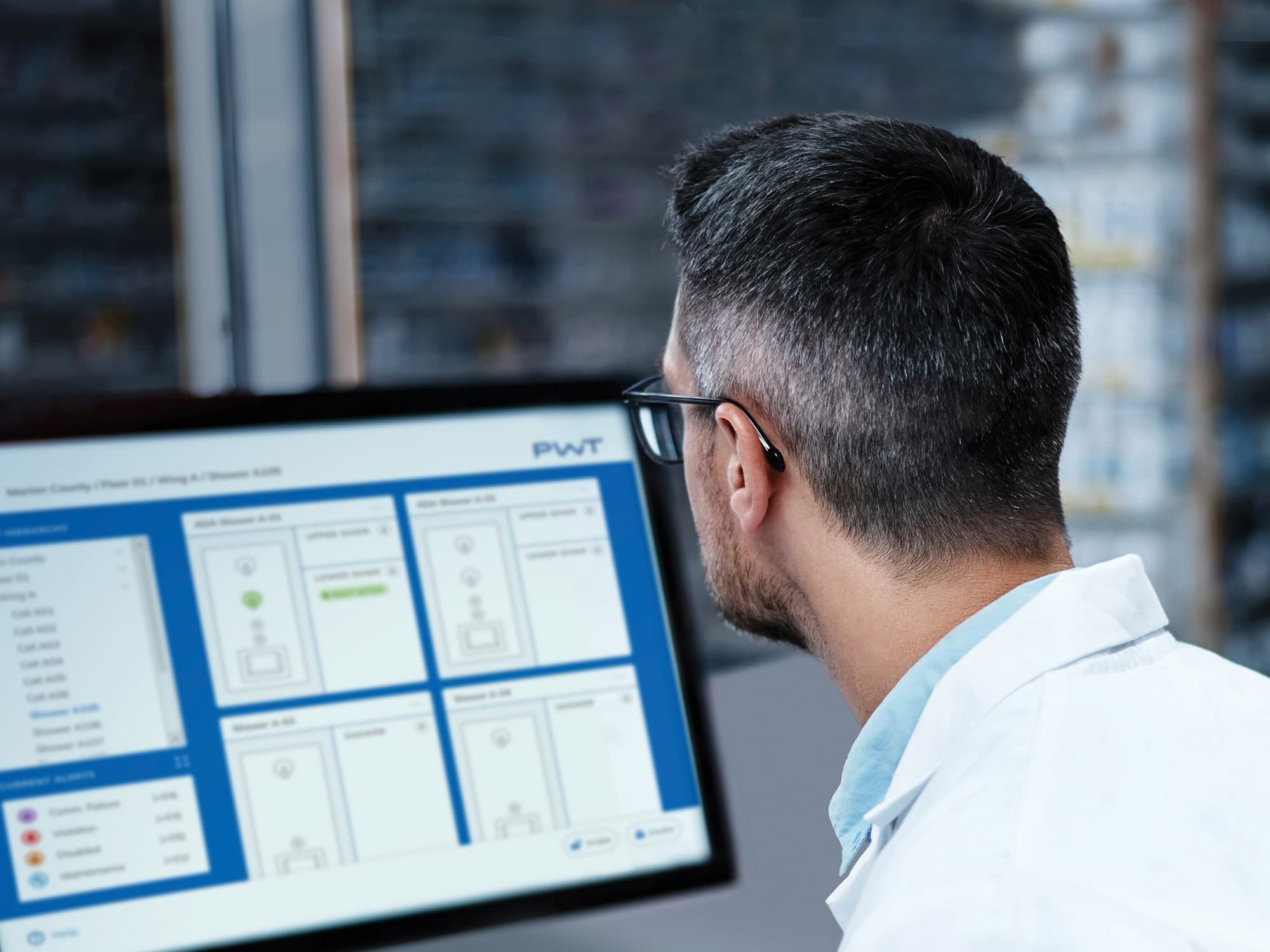 PWT hero image of a man staring at a computer screen with the PWT interface on it