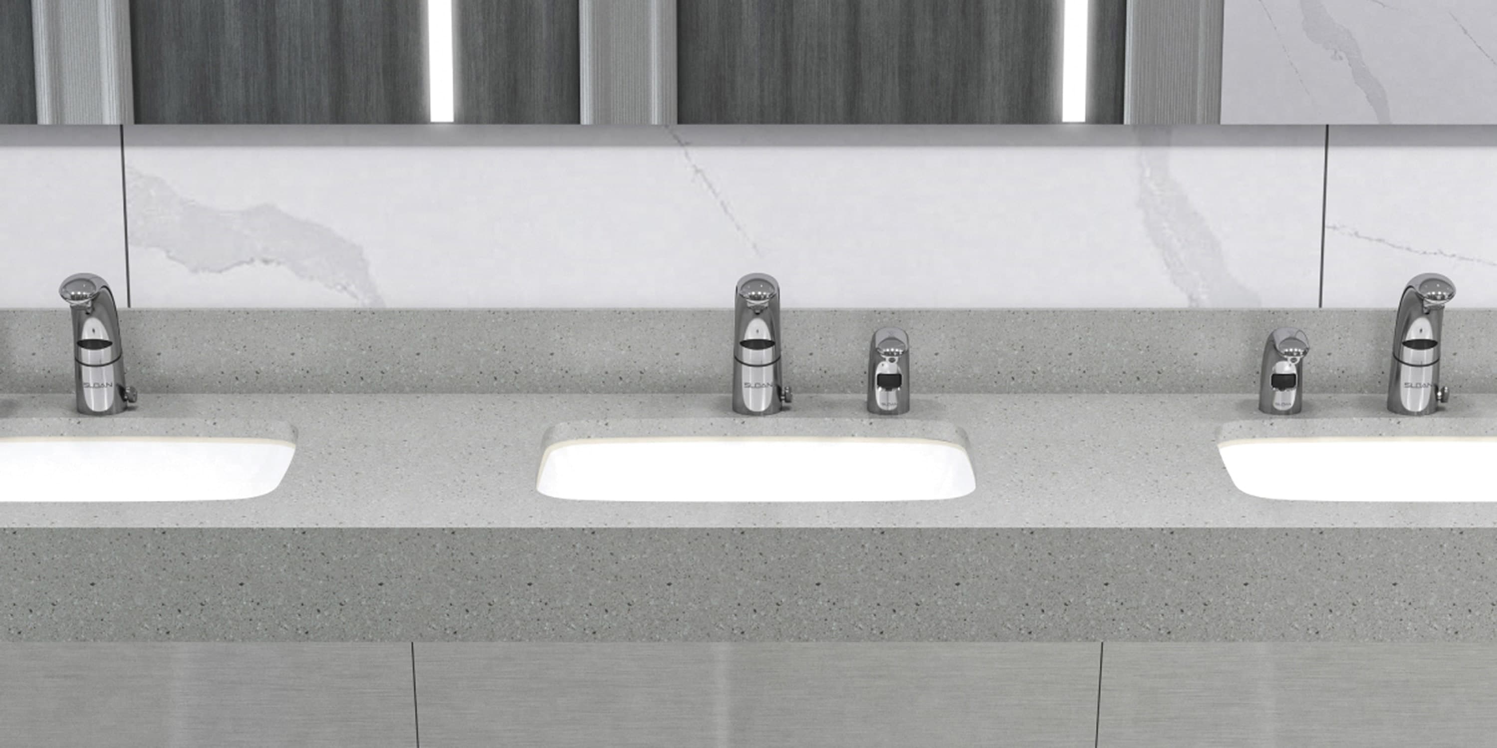 Coworking space restroom sinks with gray countertop, mirrors, and modern fixtures.
