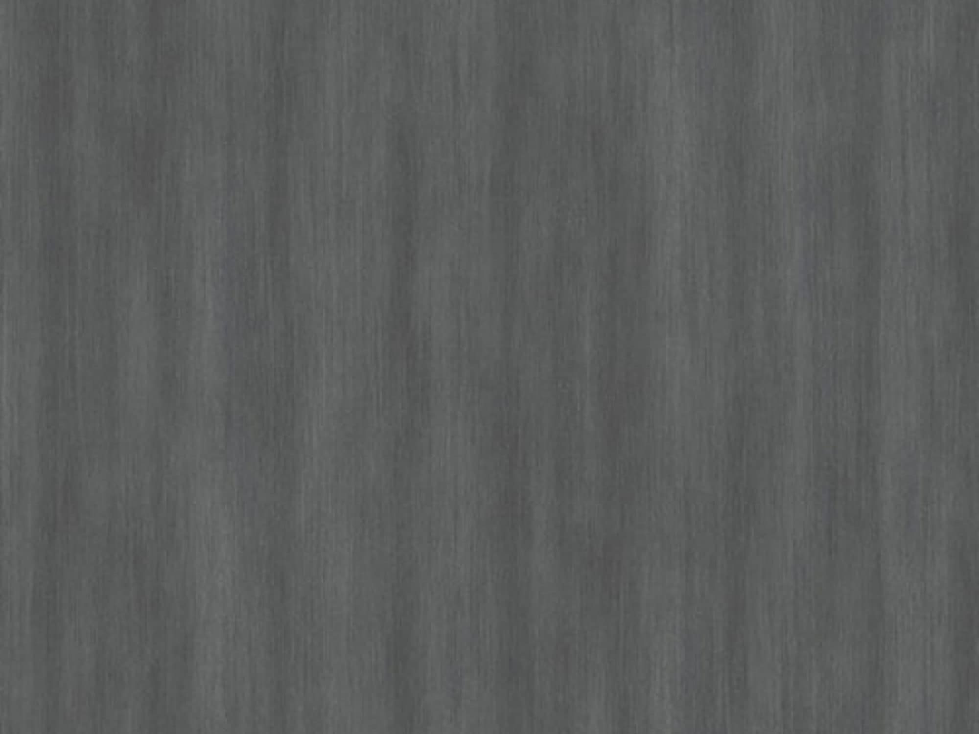 Close-up of a dark gray wood-textured surface.