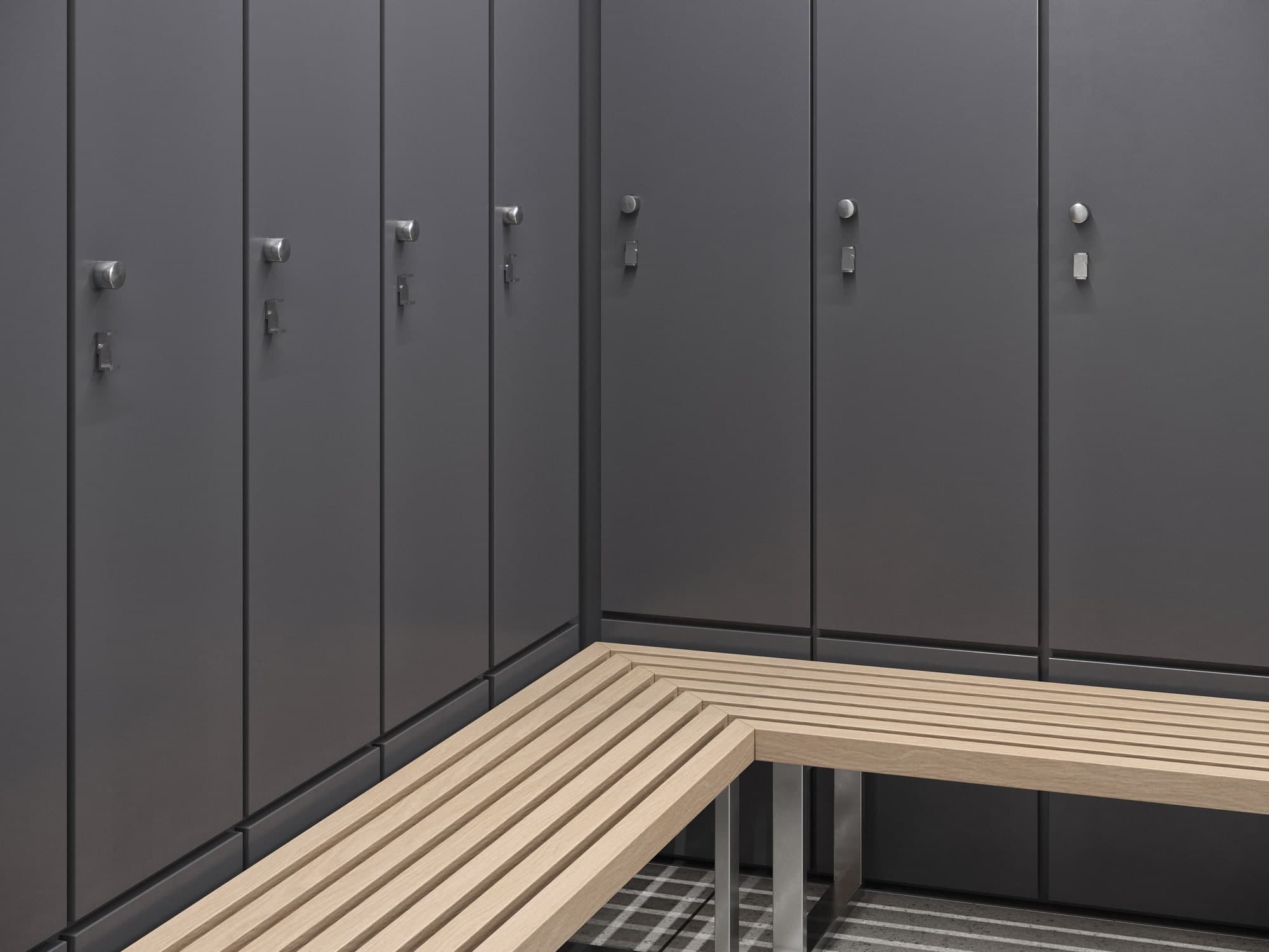 Close-up of dark gray lockers with wood bench corner detail.