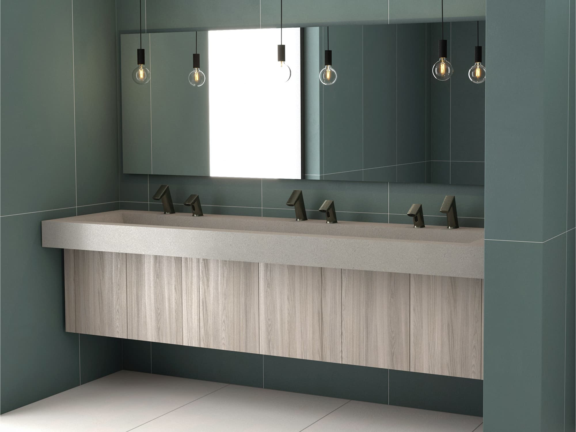 Long gray stone sink with wood vanity base and dark green wall backdrop.