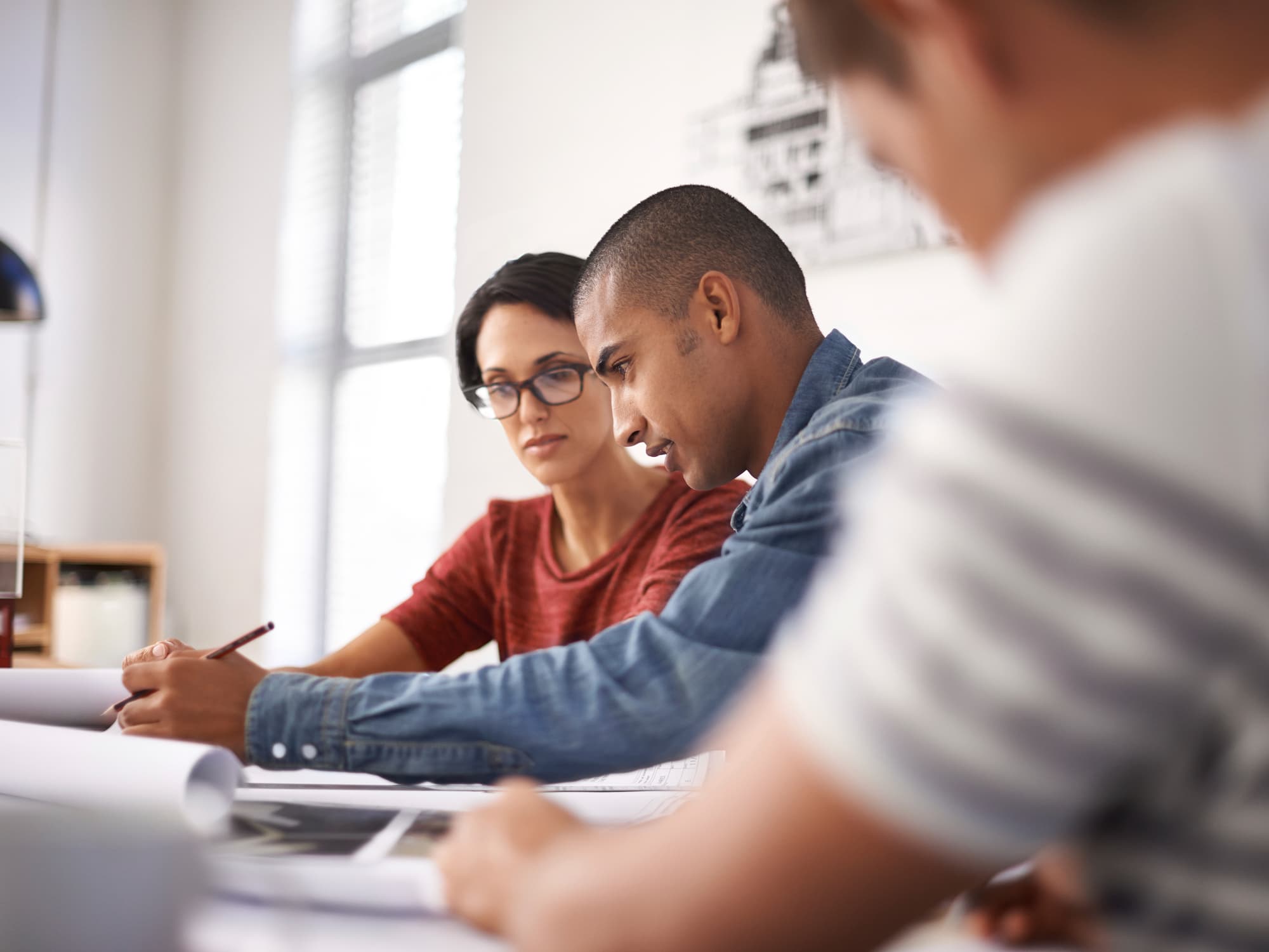 Architects and designers reviewing documents