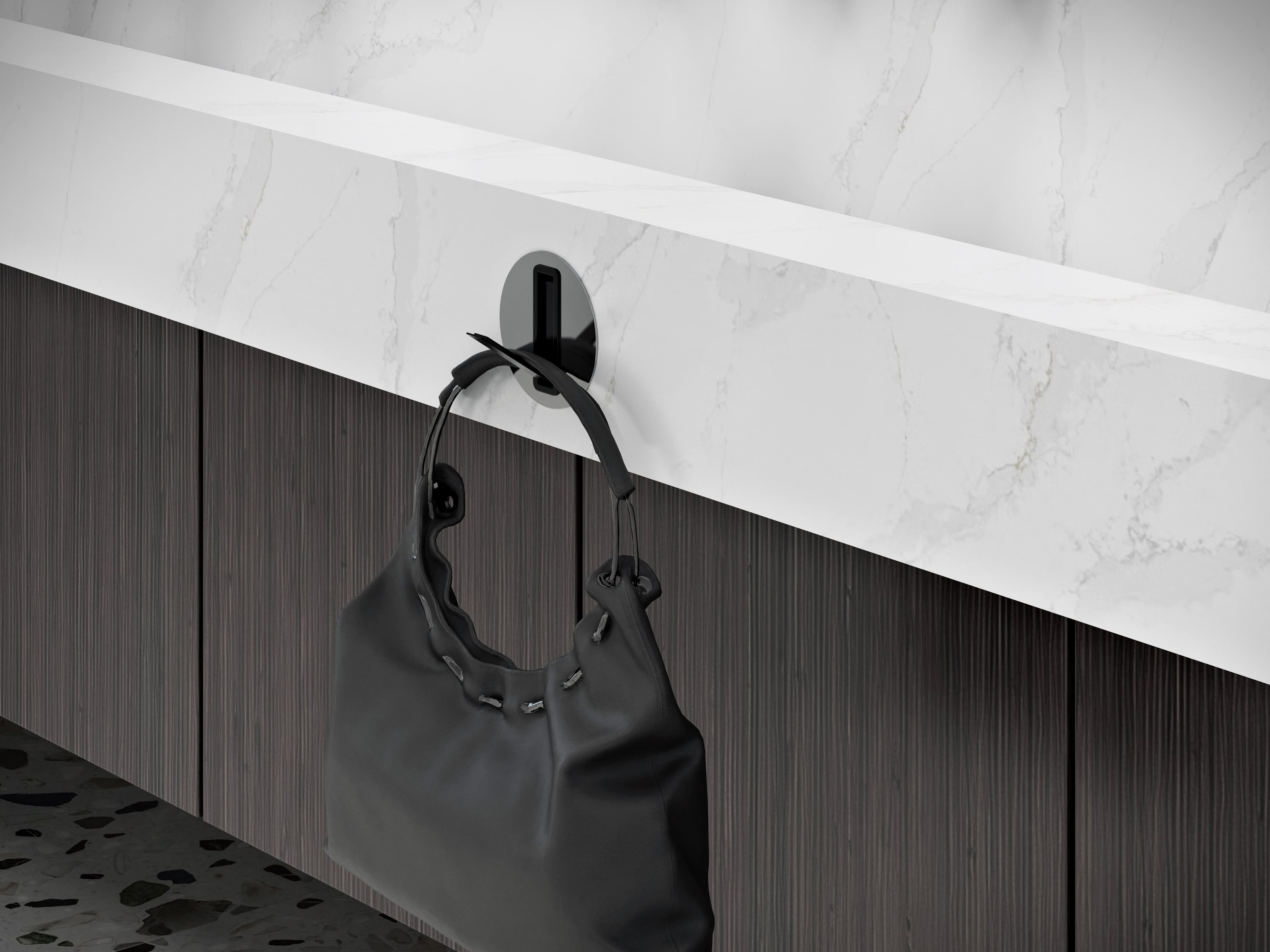 FLITE-DEC™ Integrated Sink System detail of a bag using an a bag hook in a hospitality setting