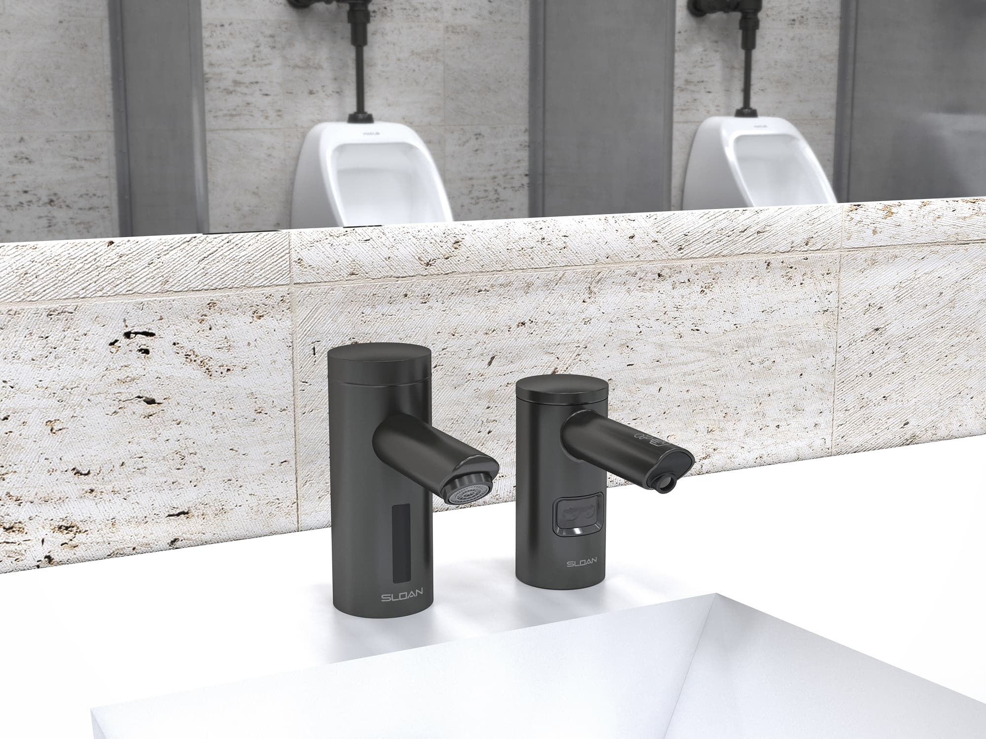 Pair of modern matte black touchless faucets mounted on a speckled stone countertop in a commercial restroom, with wall-mounted urinals visible in the background.