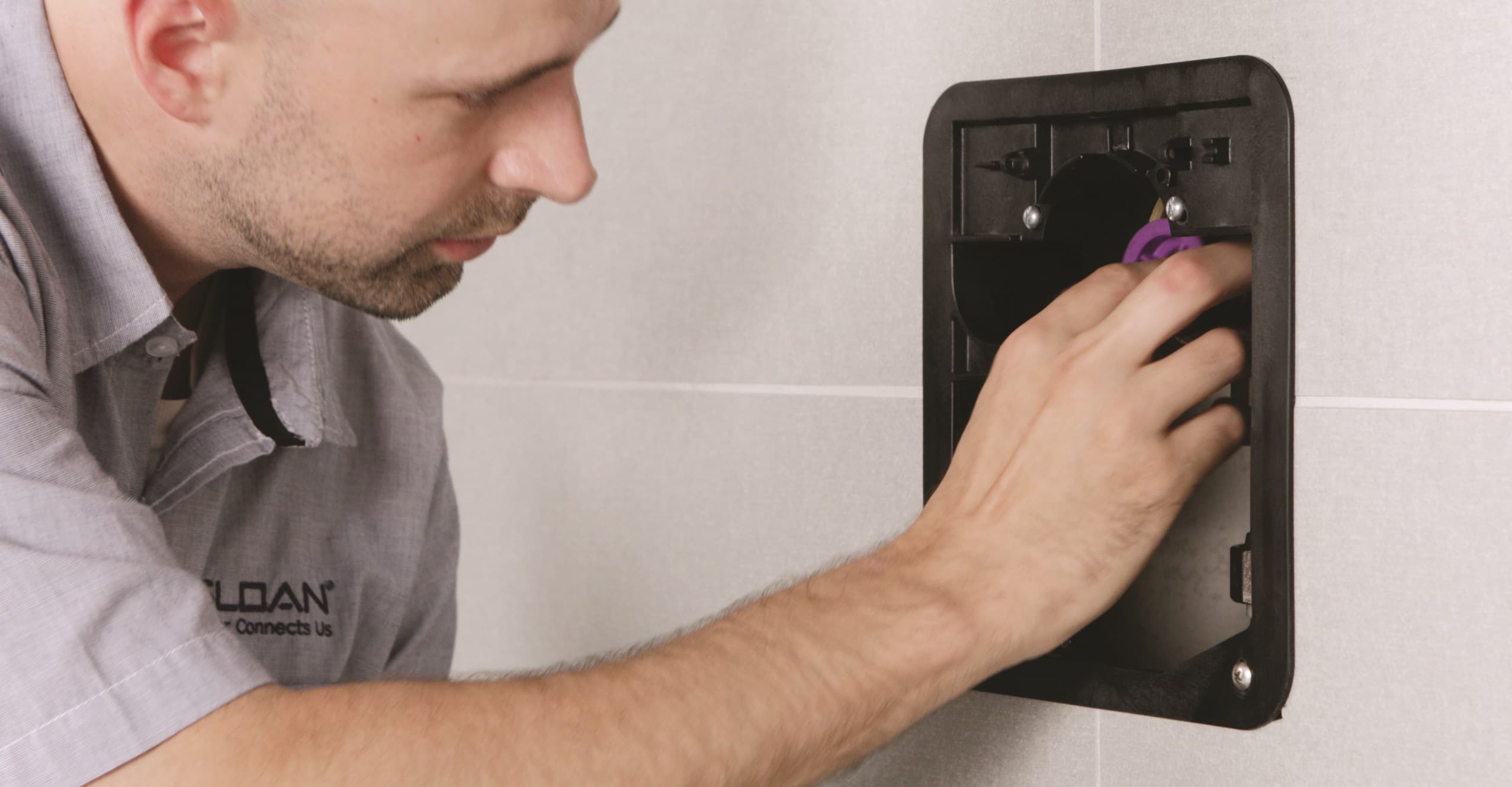 Plumbing contractor installing a CX Flushometer