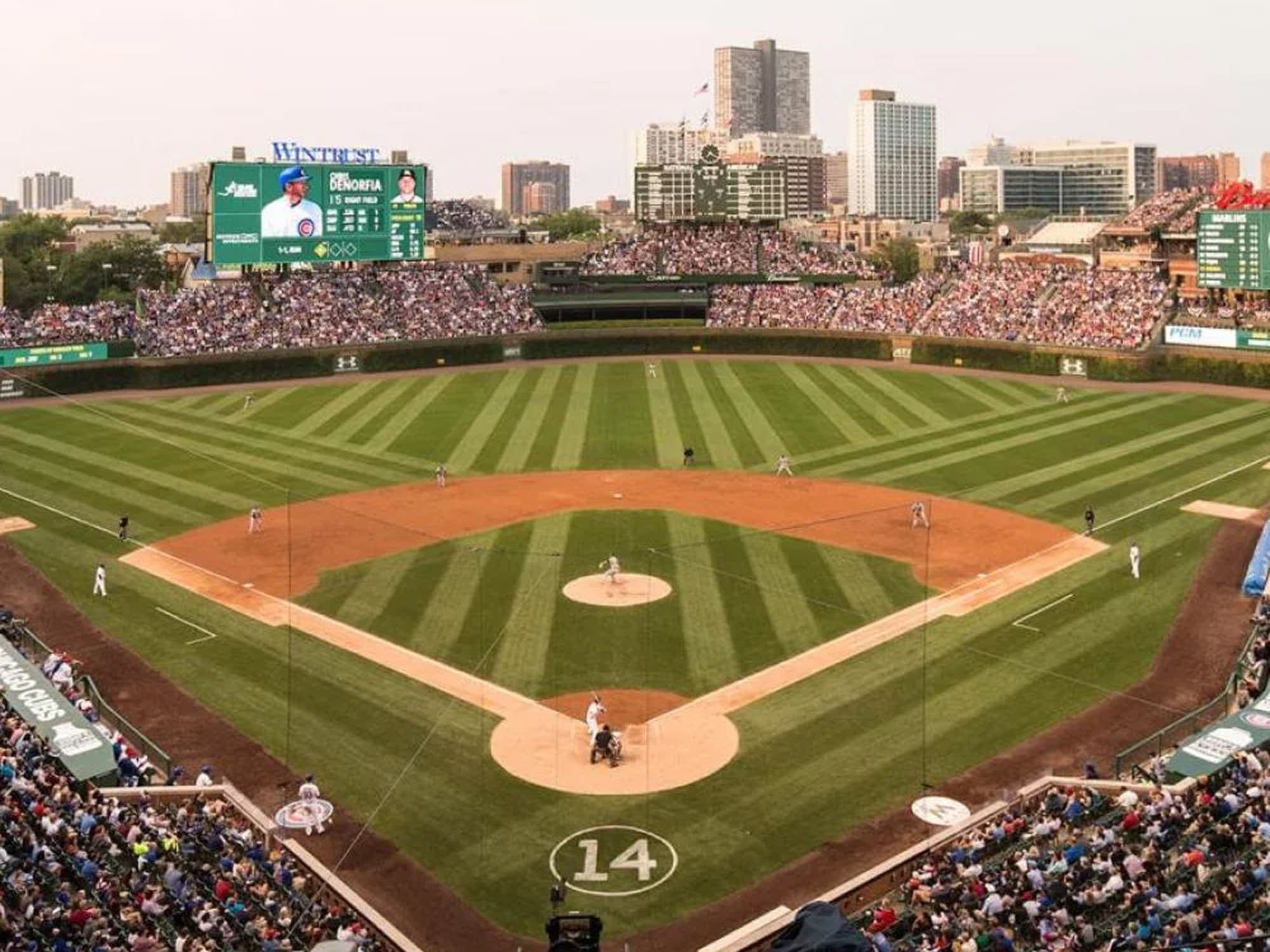 Wide view of a professional baseball stadium filled with spectators.