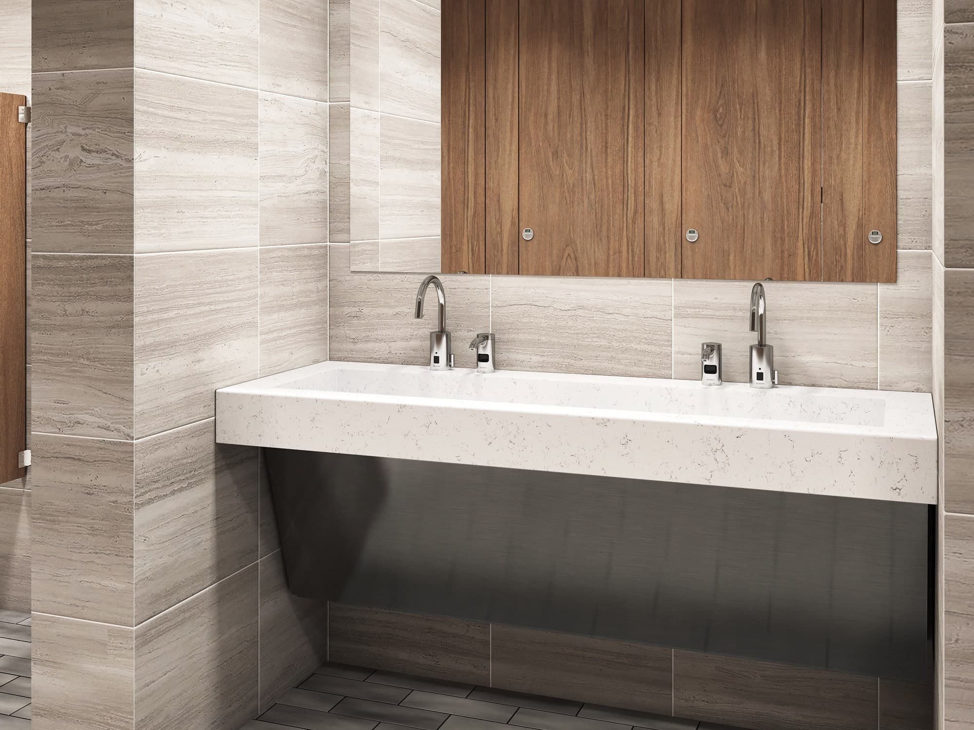 SloanStone® Quartz Gradient sink deck with wall-mounted installation in a light stone finish, paired with dual faucets in a modern restroom featuring wood accent panels and neutral stone tile walls.