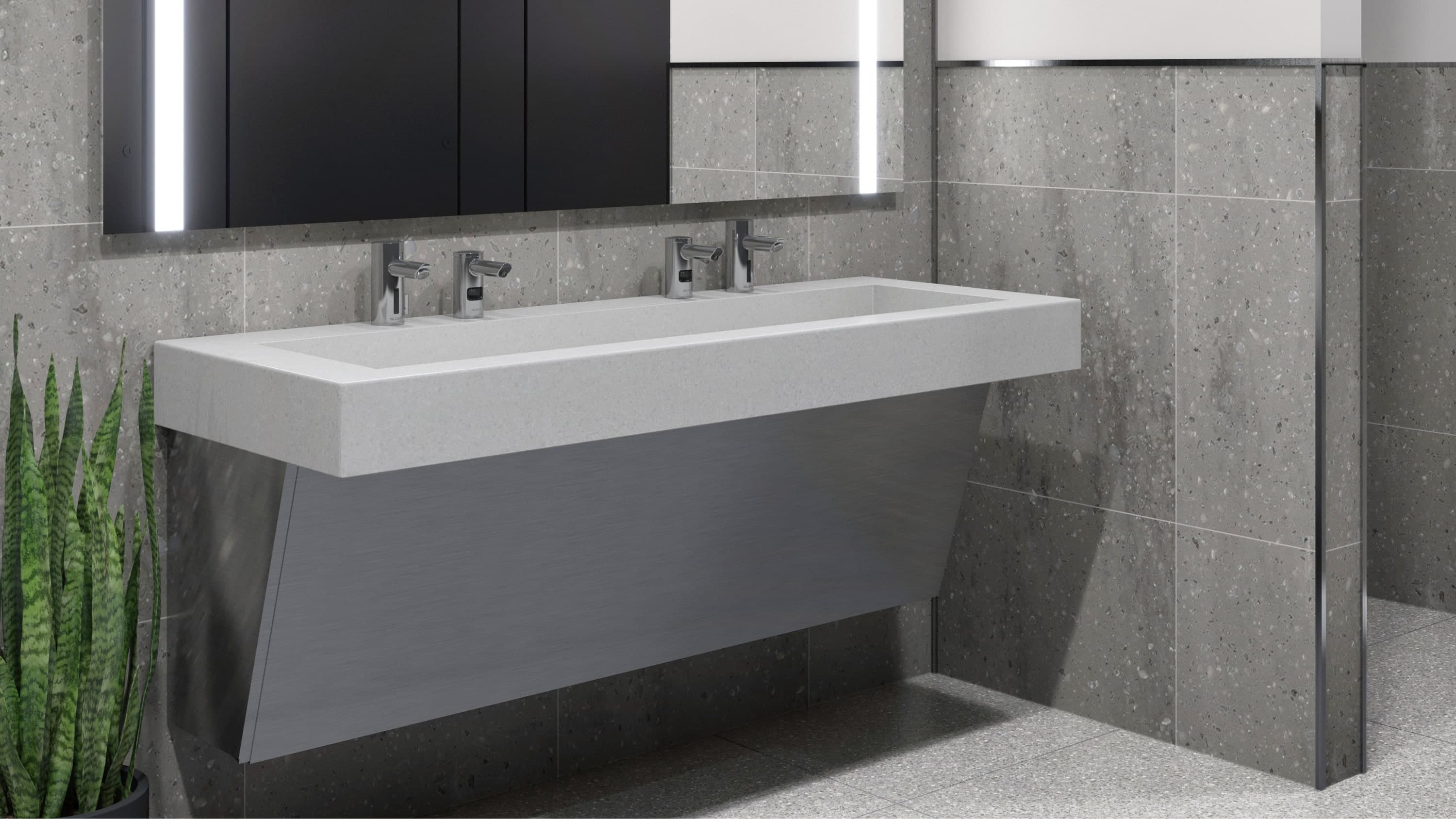 Modern SloanStone® Quartz Gradient sink deck with angular basin design, wall-mounted installation, and dual faucets in a contemporary restroom with gray tiled walls and floor.