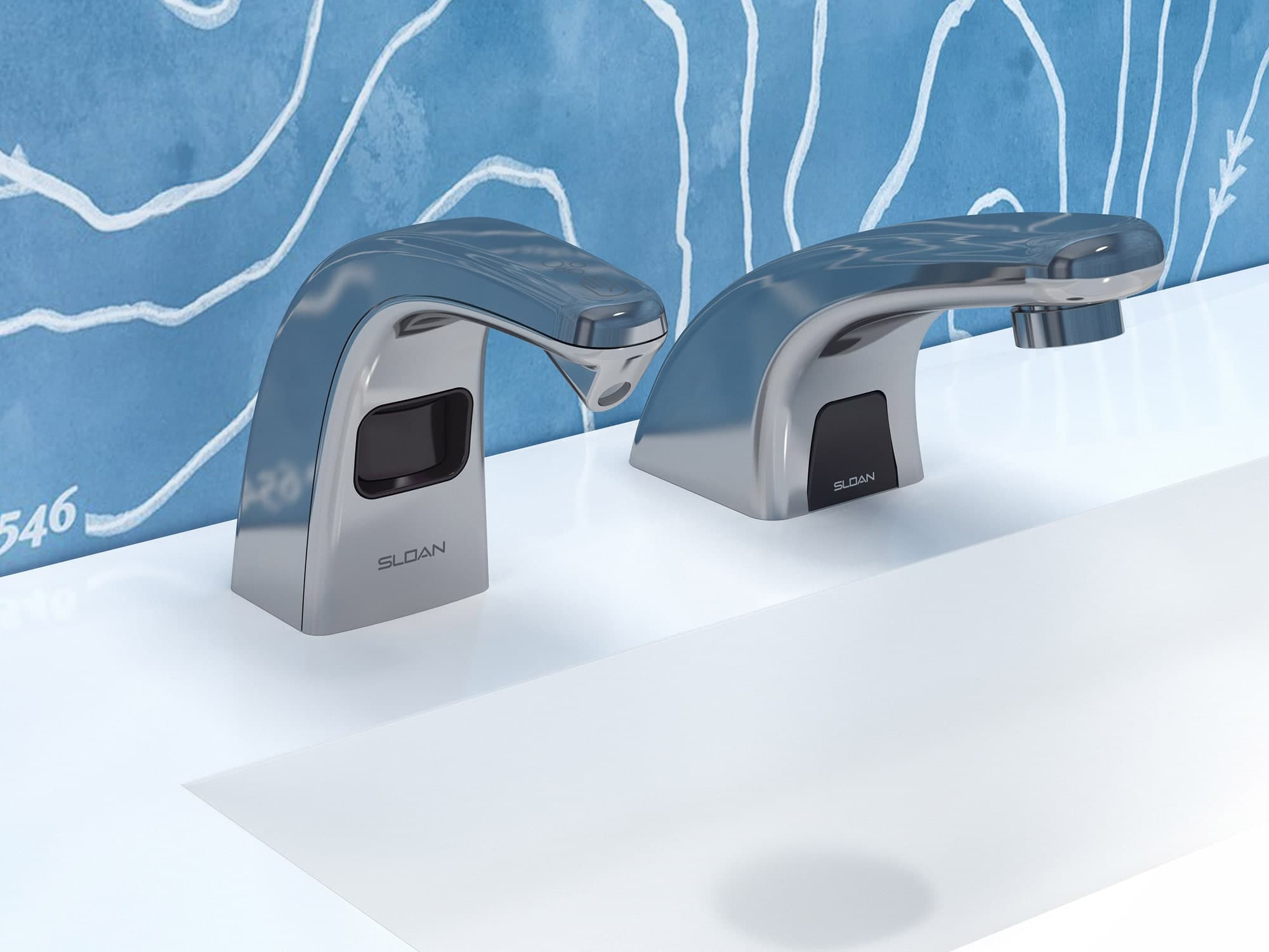 Polished chrome sensor-activated soap dispenser and matching faucet with curved design, mounted on a white countertop in front of a blue patterned wall.