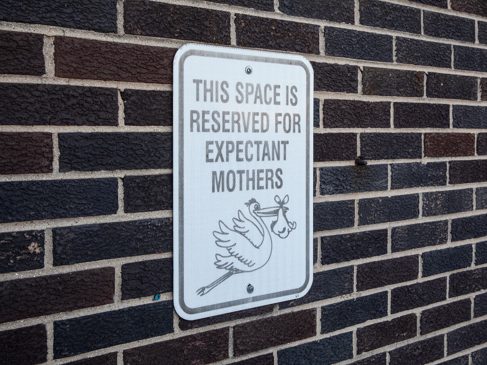 A parking spot reserved for pregnant female workers at Sloan HQ