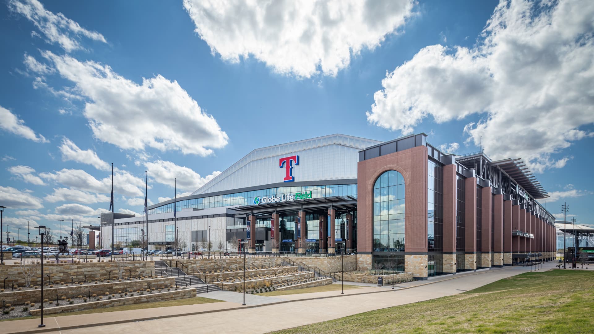street view of stadium featuring brick and glass exteriors