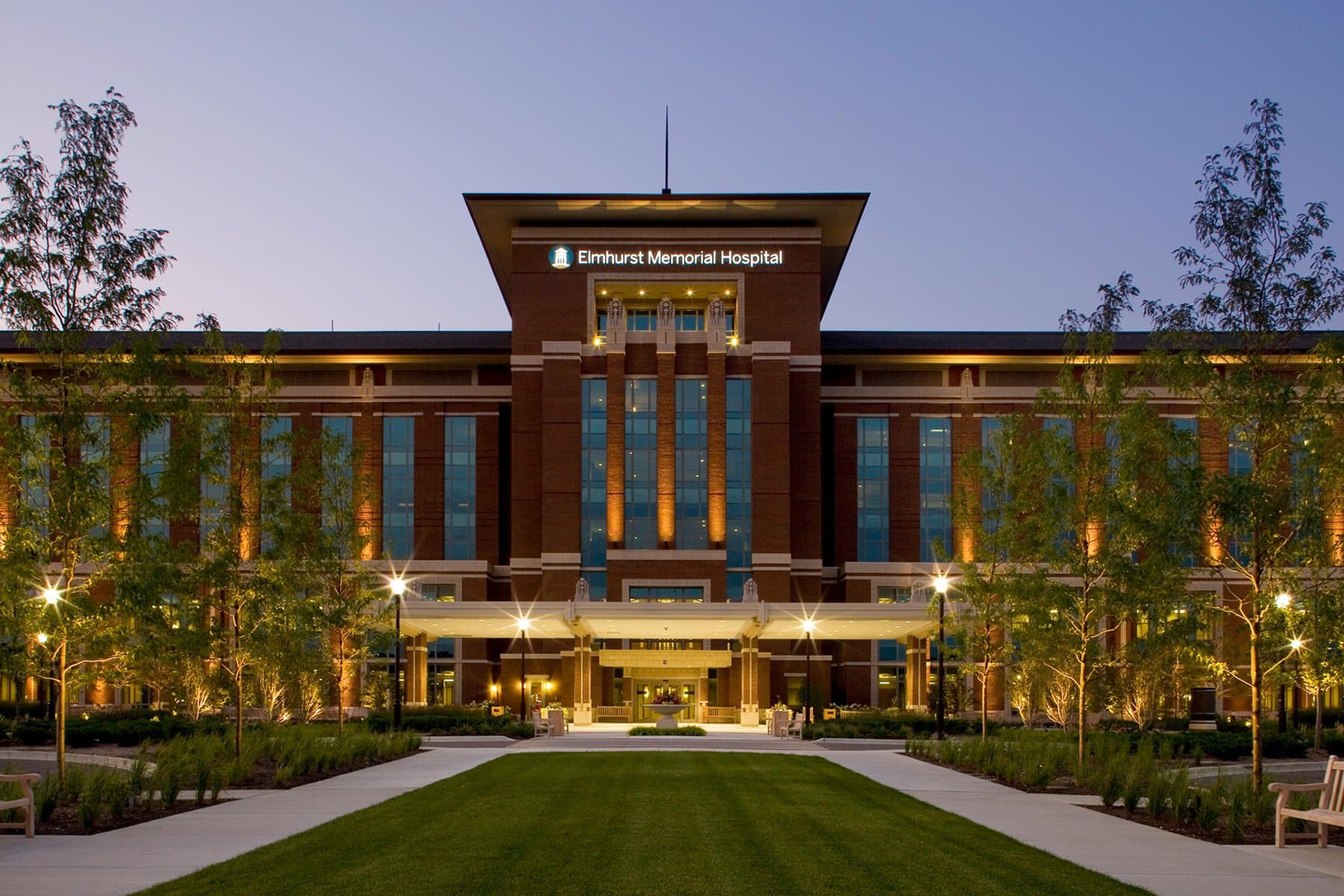 street view of entrance of hospital surrounded by green grass