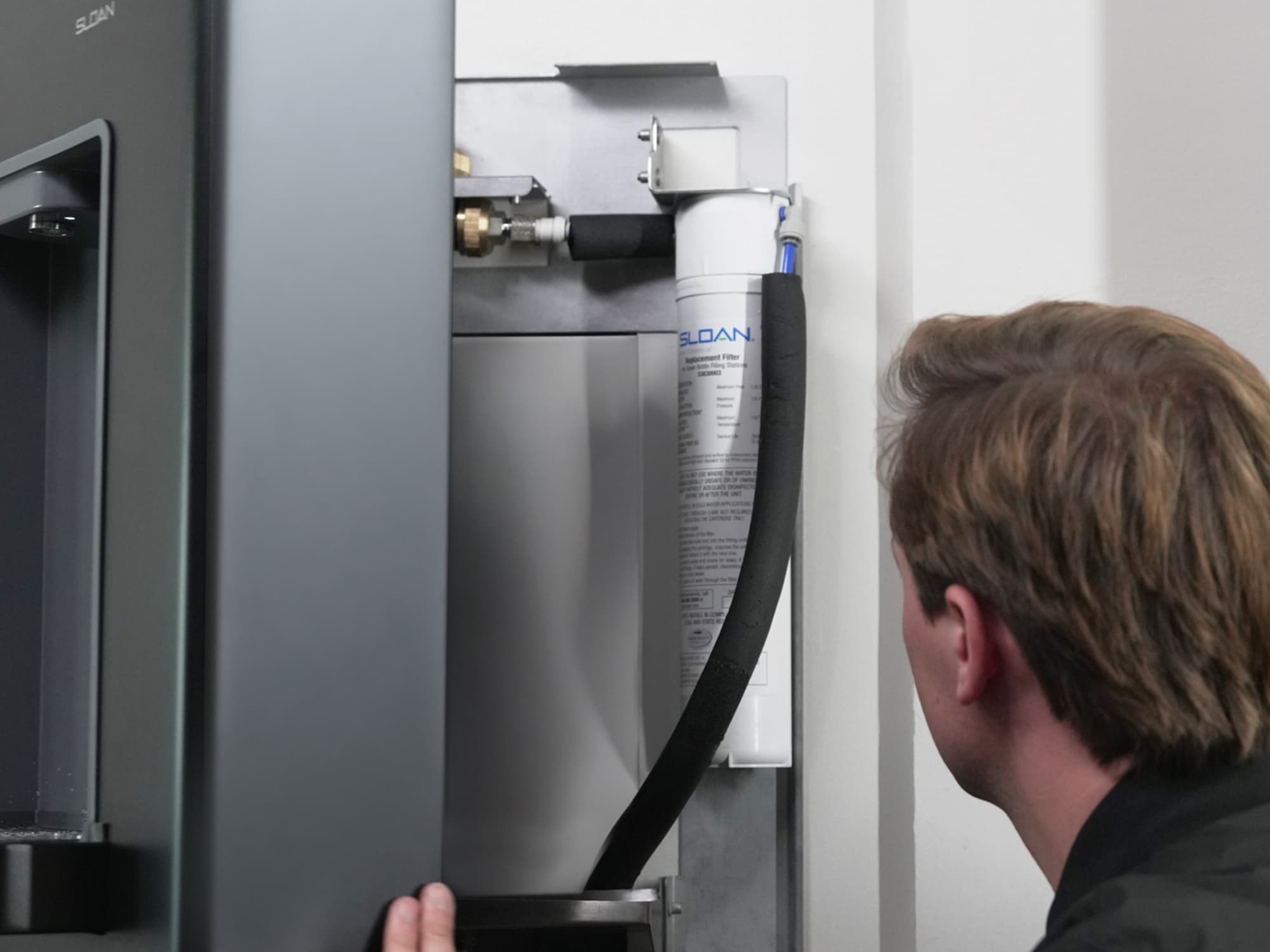 DropSpot™ Bottle Fillers swing open for filter access