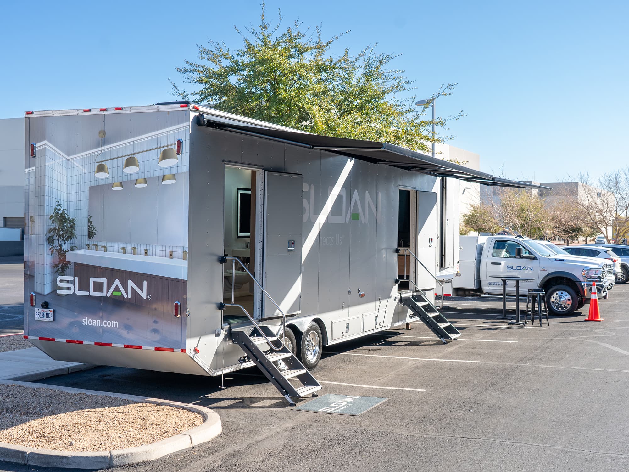 Sloan Mobile Restrooms trailer parked with doors open to provide safe, hygienic facilities for communities in need
