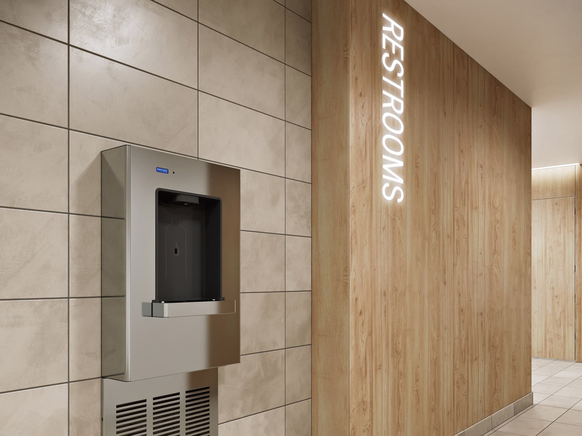 Modern hallway with tiled walls, wood paneling, a water fountain, and signage for restrooms.