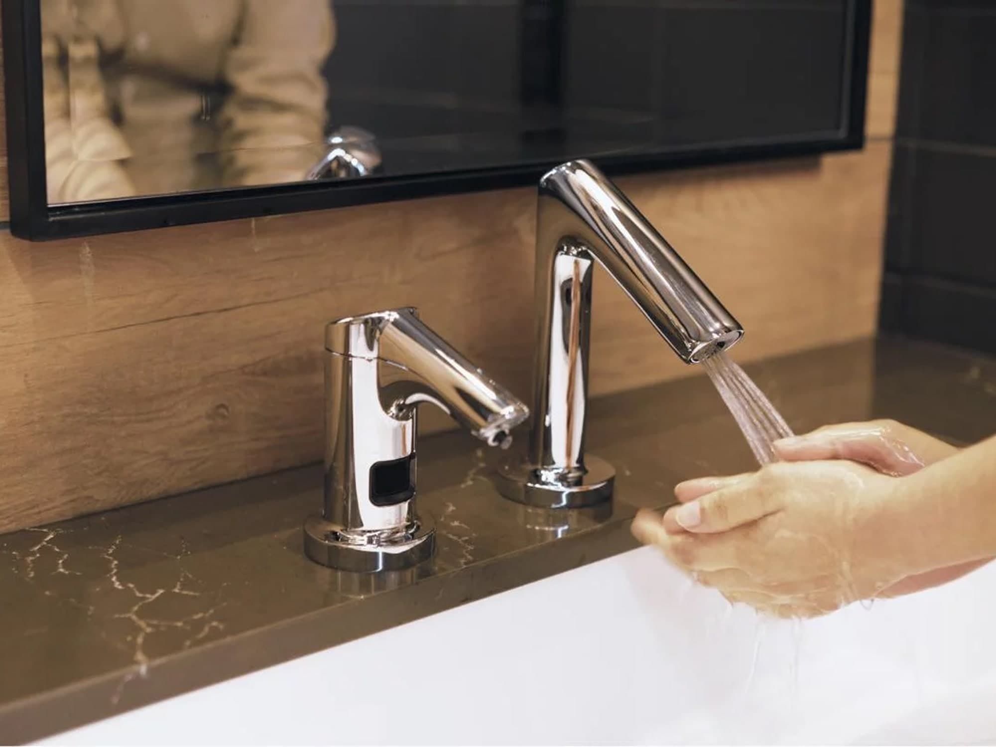 Hands being washed by a Clark St. Collection faucet that is SC Argus Pro enabled
