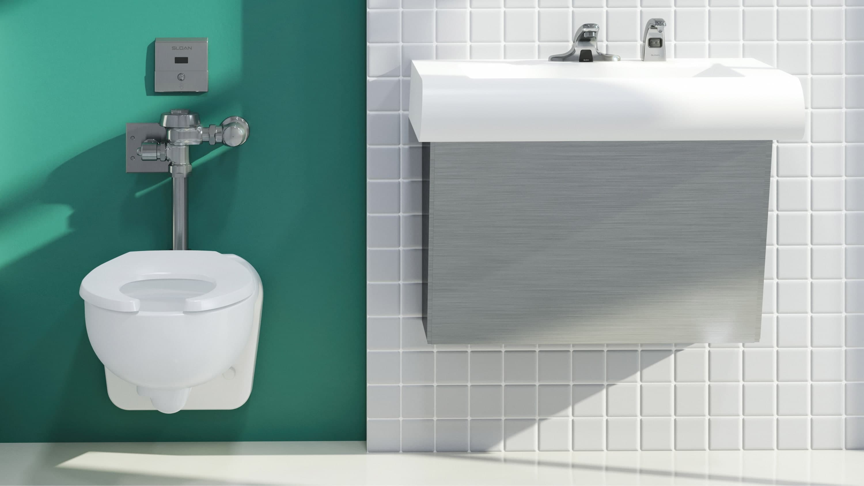 Commercial restroom with a wall-mounted toilet and a wall-mounted sink featuring dual brushed nickel faucets, set against green and white tiled walls.