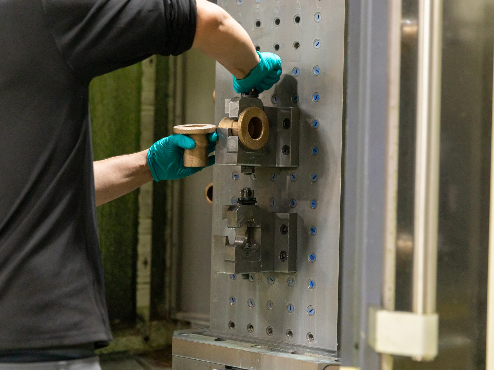 Sloan machinist calibrating a metal cast component