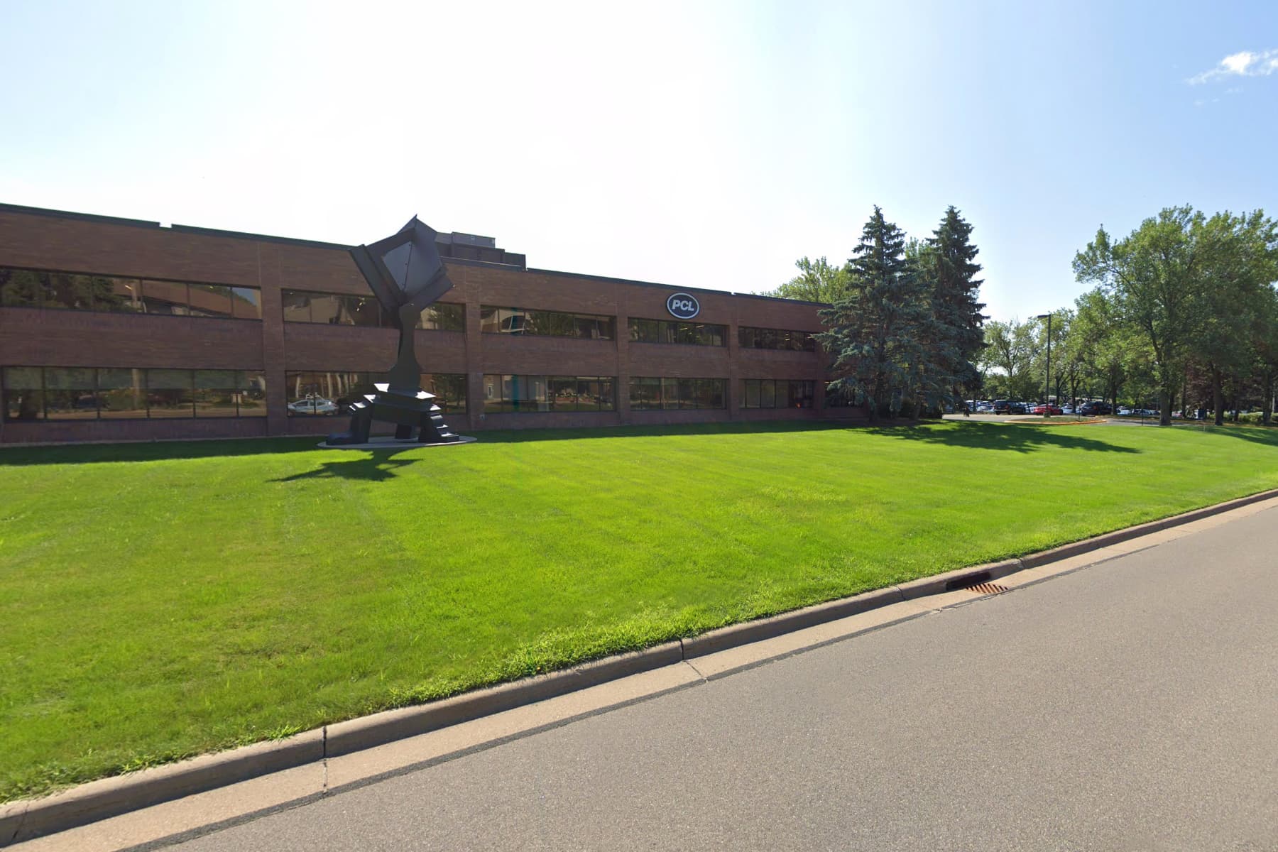street view of building with green landscaping