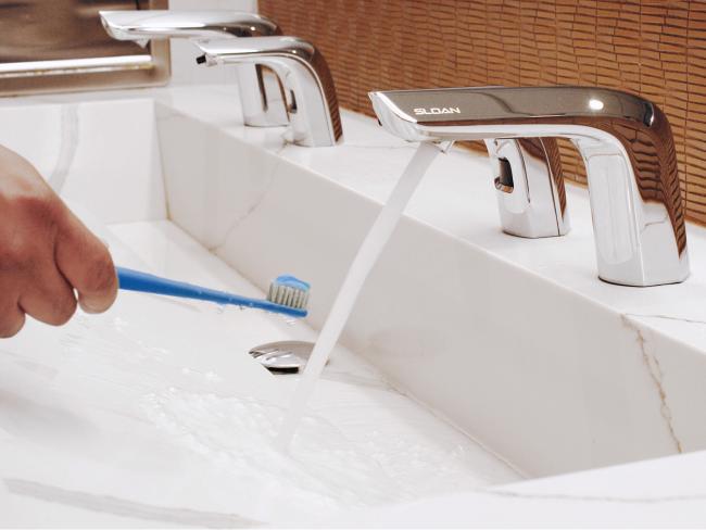 Sloan faucet washing toothbrush