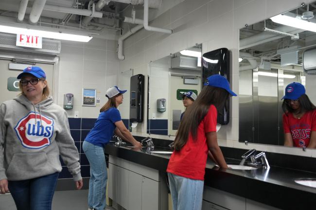 Cubs fans washing their hands using Sloan BASYS sensor faucets