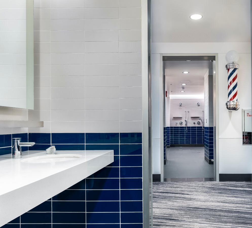 The sinks and showers in the Cubs Clubhouse restroom
